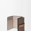 Trifold wallet in soft grained calfskin Taupe/Gold Trifold wallet in soft grained calfskin Taupe/Gold
