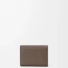 Trifold wallet in soft grained calfskin Taupe/Gold Trifold wallet in soft grained calfskin Taupe/Gold
