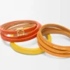 Twist double bracelet in calfskin Vivid Orange/Yellow Twist double bracelet in calfskin Vivid Orange/Yellow