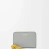 Zipped coin purse in shiny nappa calfskin Shell Grey/Dandelion Zipped coin purse in shiny nappa calfskin Shell Grey/Dandelion